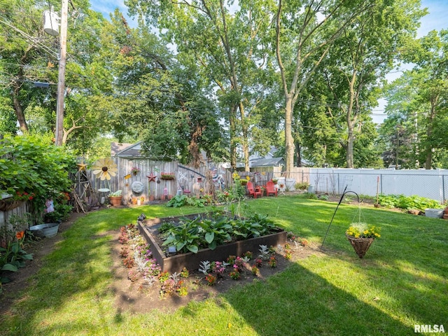 1108 Summer St, Pekin, IL 61554 - fenced backyard featuring a garden