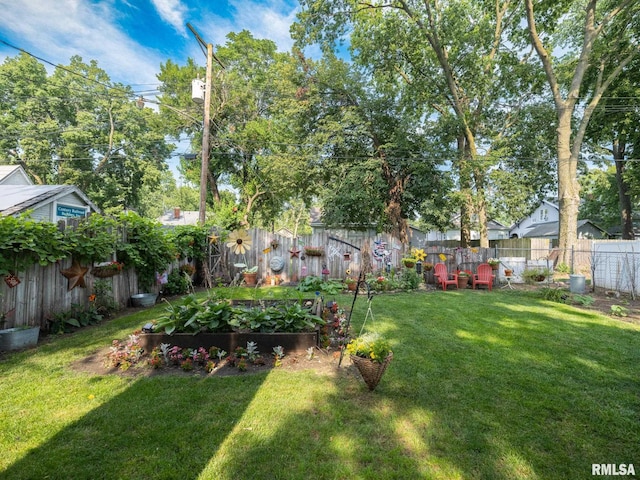 1108 Summer St, Pekin, IL 61554 - fenced backyard with a garden