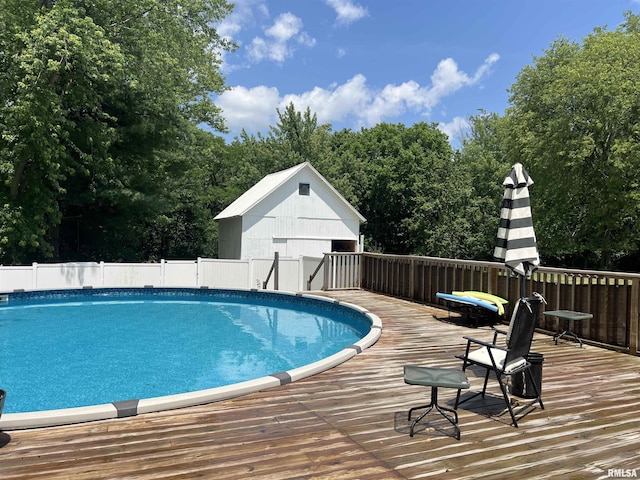 236 W Grant St, Macomb, IL 61455 - view of swimming pool featuring a deck and view of scattered trees