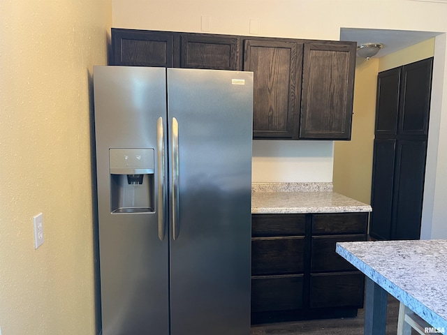236 W Grant St, Macomb, IL 61455 - kitchen featuring stainless steel fridge, light countertops, and dark brown cabinets