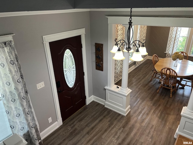 236 W Grant St, Macomb, IL 61455 - foyer featuring dark wood-style flooring, a chandelier, and crown molding