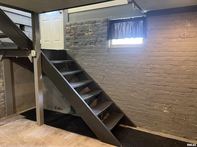 236 W Grant St, Macomb, IL 61455 - stairs with brick wall and carpet floors
