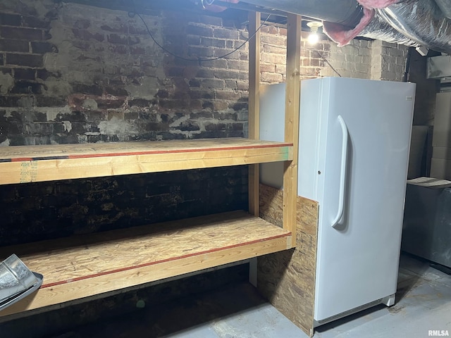 236 W Grant St, Macomb, IL 61455 - unfinished below grade area with freestanding refrigerator