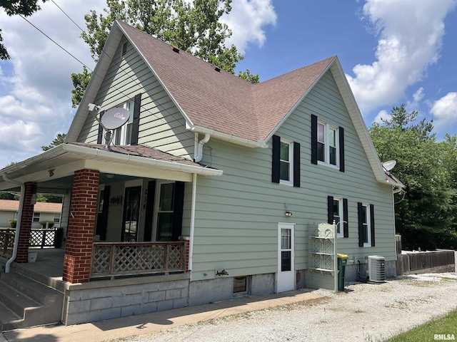 236 W Grant St, Macomb, IL 61455 - view of side of property with a porch and a shingled roof