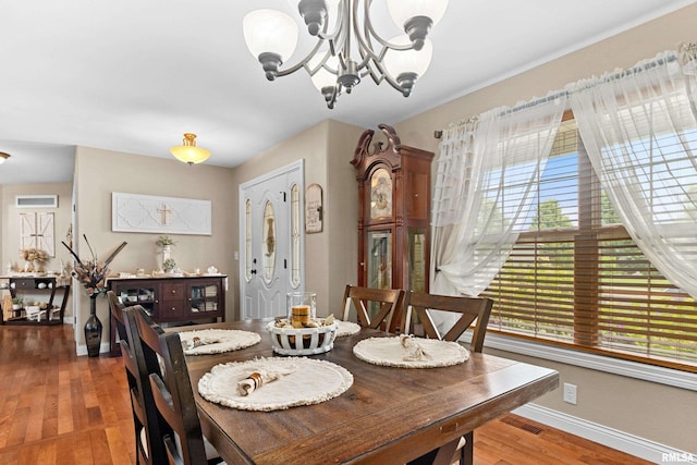 824 Debates St, Washington, IL 61571 - dining area featuring a chandelier and hardwood / wood-style flooring