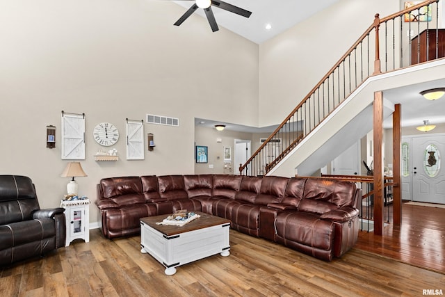 824 Debates St, Washington, IL 61571 - living room with a ceiling fan, high vaulted ceiling, wood finished floors, stairway, and recessed lighting