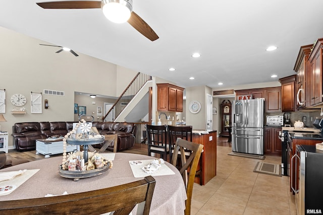 824 Debates St, Washington, IL 61571 - dining area featuring a ceiling fan, recessed lighting, light tile patterned flooring, and stairway