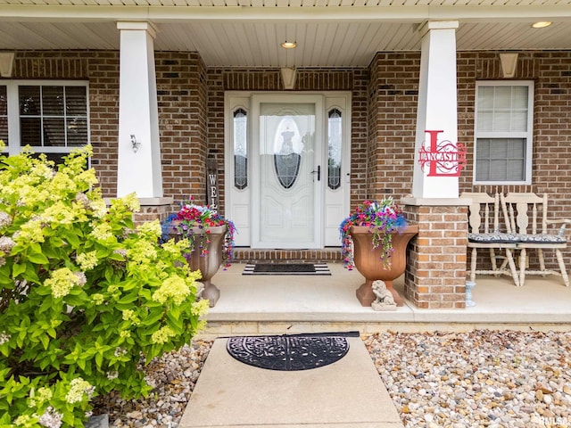 824 Debates St, Washington, IL 61571 - entrance to property featuring a porch and brick siding