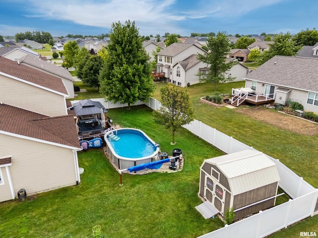 824 Debates St, Washington, IL 61571 - view of pool featuring a residential view, a fenced backyard, a deck, and a gazebo