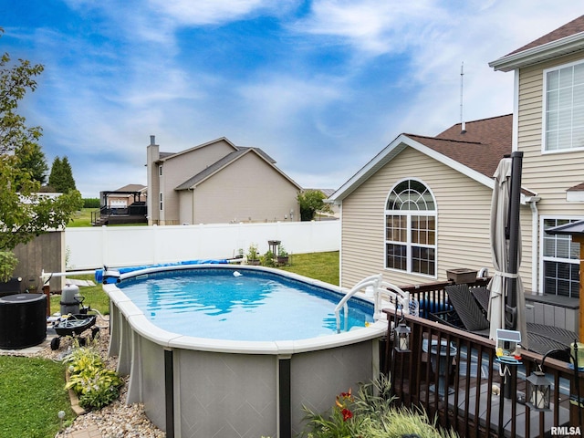 824 Debates St, Washington, IL 61571 - view of swimming pool featuring a fenced backyard and a deck
