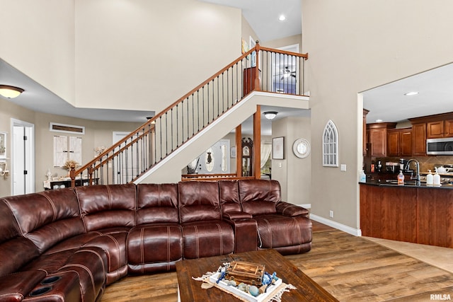 824 Debates St, Washington, IL 61571 - living area with wood finished floors, a high ceiling, recessed lighting, and stairway