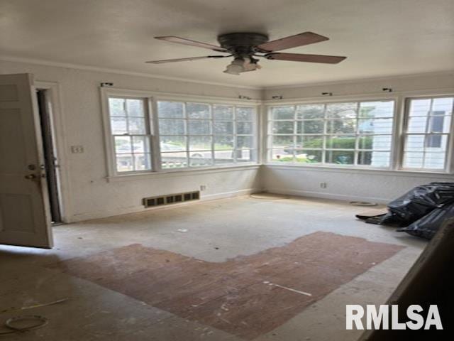 2714 W Laura Ave, West Peoria, IL 61604 - unfurnished sunroom with healthy amount of natural light and crown molding