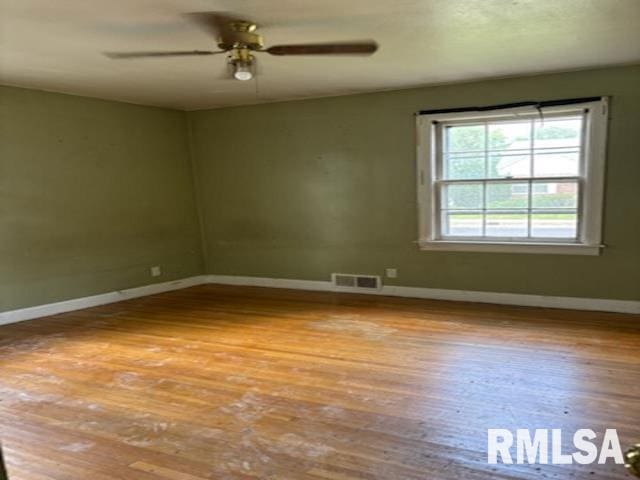 2714 W Laura Ave, West Peoria, IL 61604 - spare room with wood finished floors and a ceiling fan