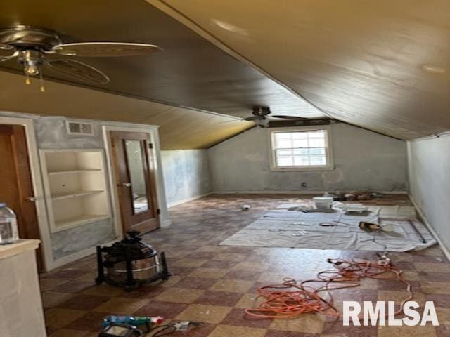 2714 W Laura Ave, West Peoria, IL 61604 - additional living space featuring a ceiling fan, built in features, tile patterned floors, and lofted ceiling