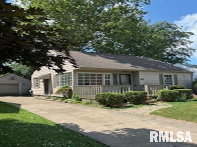 2714 W Laura Ave, West Peoria, IL 61604 - view of front of home with an outdoor structure, a garage, and a front yard