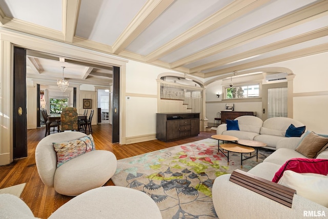 1227 W Barker Ave, Peoria, IL 61606 - living room with wood finished floors, beam ceiling, ornamental molding, a chandelier, and decorative columns