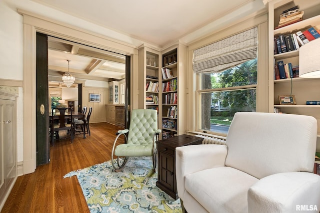 1227 W Barker Ave, Peoria, IL 61606 - living area featuring wood finished floors, a chandelier, coffered ceiling, beamed ceiling, and ornamental molding