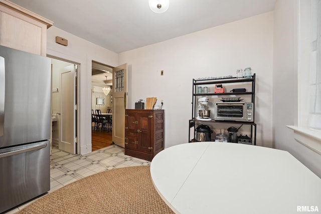1227 W Barker Ave, Peoria, IL 61606 - bedroom with freestanding refrigerator and light flooring