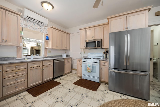 1227 W Barker Ave, Peoria, IL 61606 - kitchen featuring stainless steel appliances, light floors, a wall mounted AC, ceiling fan, and light brown cabinets