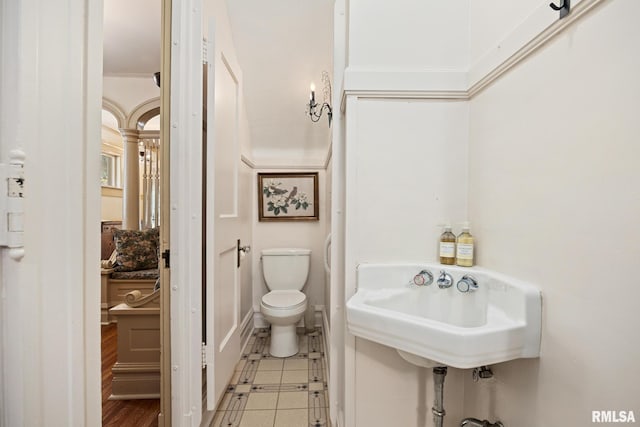 1227 W Barker Ave, Peoria, IL 61606 - bathroom featuring toilet and ornamental molding
