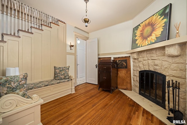 1227 W Barker Ave, Peoria, IL 61606 - living room with wood finished floors and a stone fireplace