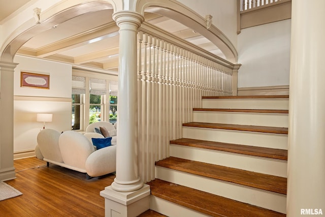 1227 W Barker Ave, Peoria, IL 61606 - stairway featuring wood finished floors, ornate columns, and arched walkways