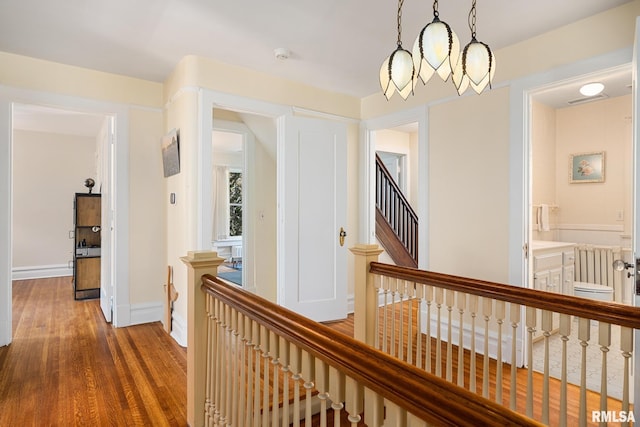 1227 W Barker Ave, Peoria, IL 61606 - hallway with wood finished floors and an upstairs landing