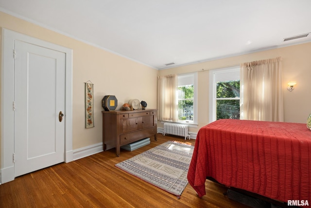 1227 W Barker Ave, Peoria, IL 61606 - bedroom with radiator, ornamental molding, and wood finished floors