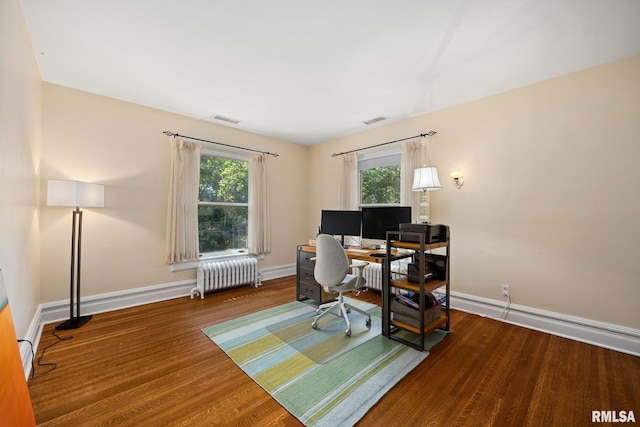 1227 W Barker Ave, Peoria, IL 61606 - office featuring radiator heating unit, healthy amount of natural light, and wood finished floors
