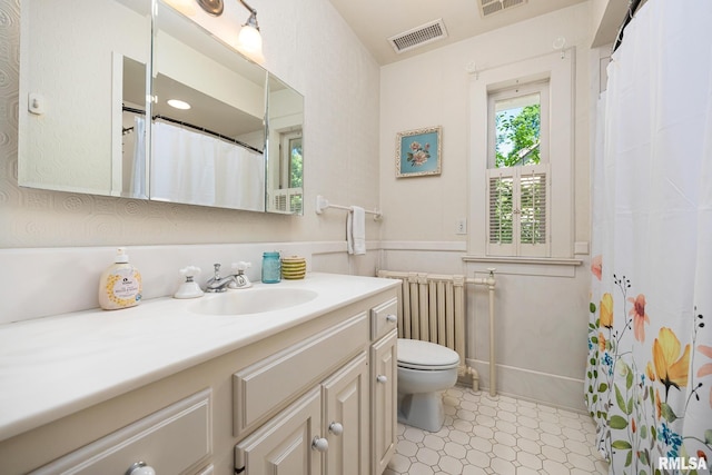1227 W Barker Ave, Peoria, IL 61606 - full bathroom featuring vanity, radiator heating unit, tile patterned floors, and curtained shower