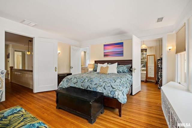 1227 W Barker Ave, Peoria, IL 61606 - bedroom featuring light wood finished floors and radiator heating unit
