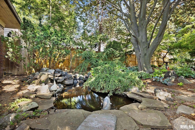 1227 W Barker Ave, Peoria, IL 61606 - view of yard with a small pond