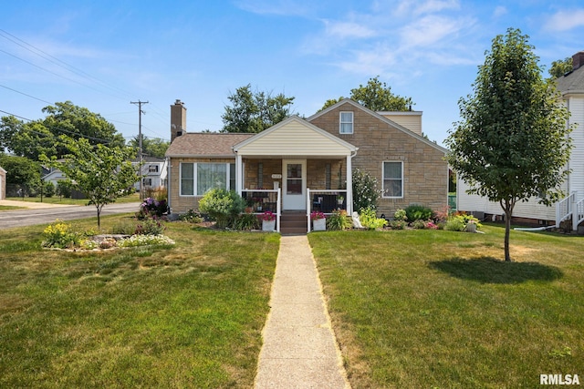 3126 N Avalon Pl, Peoria, IL 61604 - bungalow-style house featuring a porch, a front yard, stone siding, and a chimney