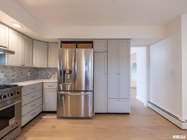 2810 Deveron Cir, Pekin, IL 61554 - kitchen featuring stainless steel appliances, a baseboard radiator, gray cabinetry, and light wood-style floors