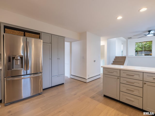 2810 Deveron Cir, Pekin, IL 61554 - kitchen with stainless steel refrigerator with ice dispenser, a baseboard heating unit, gray cabinetry, light wood finished floors, and recessed lighting