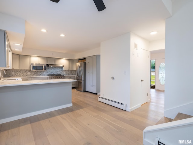 2810 Deveron Cir, Pekin, IL 61554 - kitchen featuring stainless steel appliances, a baseboard heating unit, gray cabinetry, a ceiling fan, and light countertops