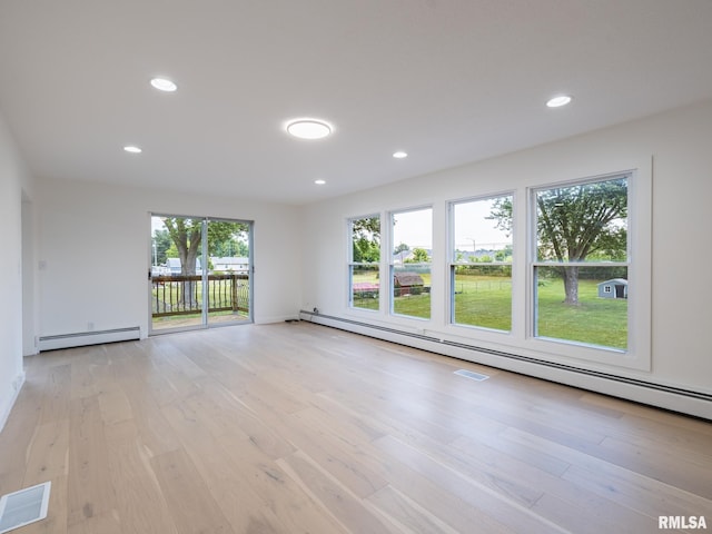 2810 Deveron Cir, Pekin, IL 61554 - spare room featuring a baseboard heating unit, light wood finished floors, and recessed lighting