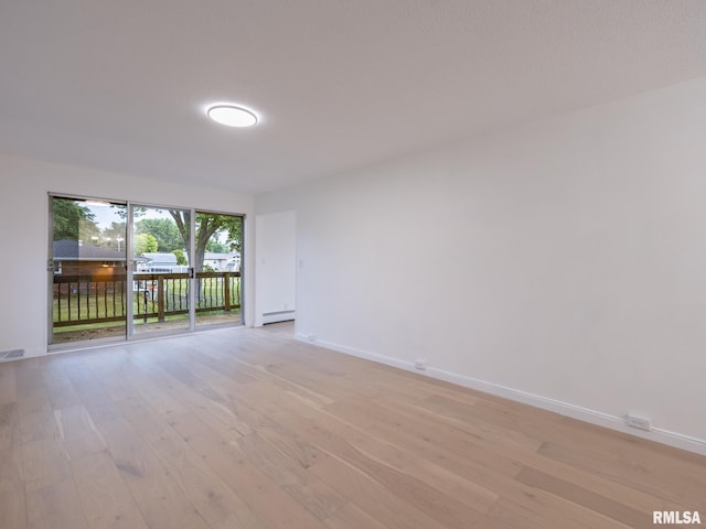2810 Deveron Cir, Pekin, IL 61554 - spare room with light wood-style flooring and a baseboard heating unit