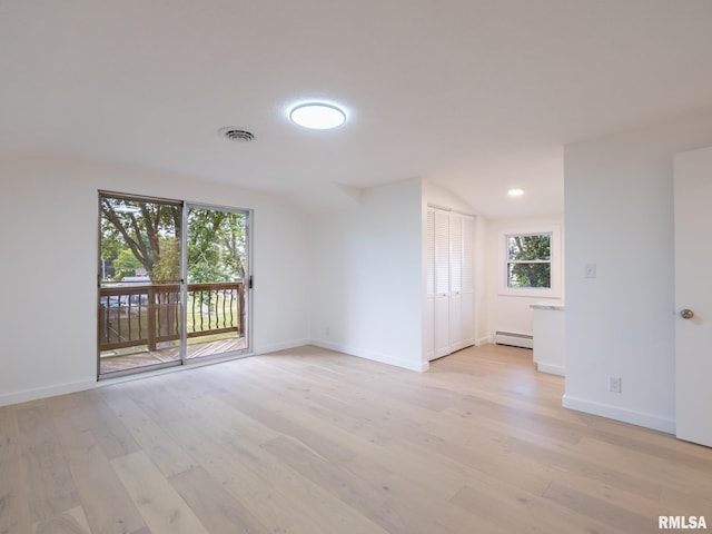 2810 Deveron Cir, Pekin, IL 61554 - spare room with baseboard heating, plenty of natural light, light wood finished floors, and recessed lighting