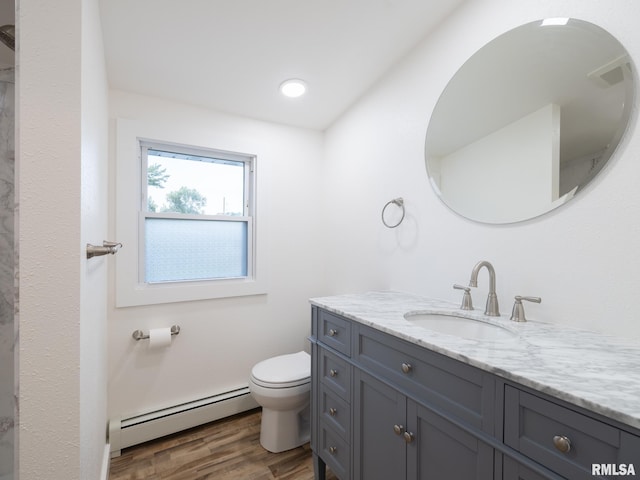 2810 Deveron Cir, Pekin, IL 61554 - full bathroom featuring baseboard heating, vanity, and wood finished floors