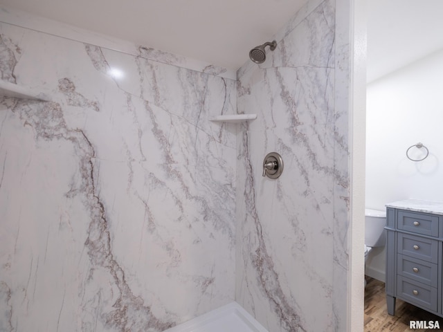 2810 Deveron Cir, Pekin, IL 61554 - bathroom featuring a marble finish shower, vanity, and wood finished floors