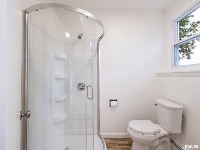 2810 Deveron Cir, Pekin, IL 61554 - bathroom with a stall shower, wood finished floors, and a baseboard heating unit