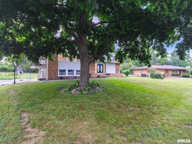 2810 Deveron Cir, Pekin, IL 61554 - view of front facade featuring a front yard and brick siding