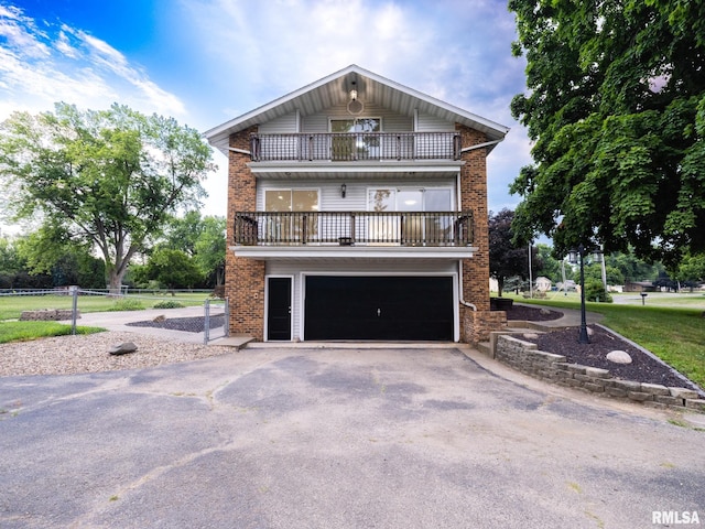 2810 Deveron Cir, Pekin, IL 61554 - view of front facade with a balcony, driveway, brick siding, and a garage