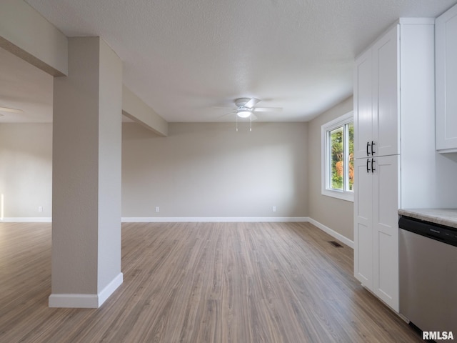 2922 W Larchmont Ln, Peoria, IL 61615 - unfurnished living room featuring ceiling fan and light wood-style flooring