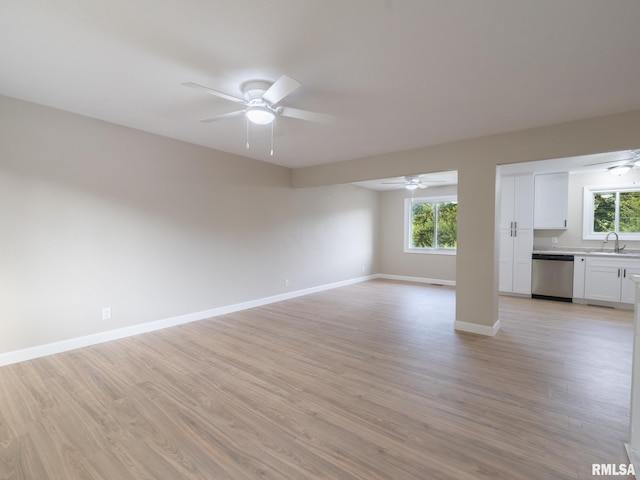 2922 W Larchmont Ln, Peoria, IL 61615 - unfurnished living room with a ceiling fan and light wood-type flooring