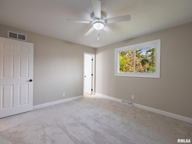 2922 W Larchmont Ln, Peoria, IL 61615 - unfurnished bedroom featuring carpet floors and ceiling fan
