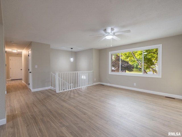 2922 W Larchmont Ln, Peoria, IL 61615 - unfurnished room with wood finished floors and ceiling fan