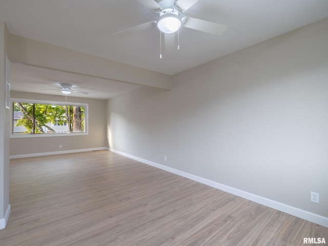 2922 W Larchmont Ln, Peoria, IL 61615 - unfurnished room featuring light wood-type flooring and a ceiling fan