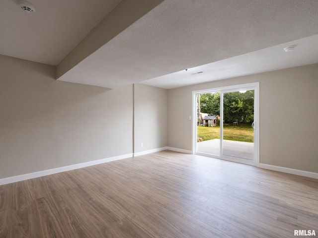 2922 W Larchmont Ln, Peoria, IL 61615 - spare room featuring a smoke detector and wood finished floors